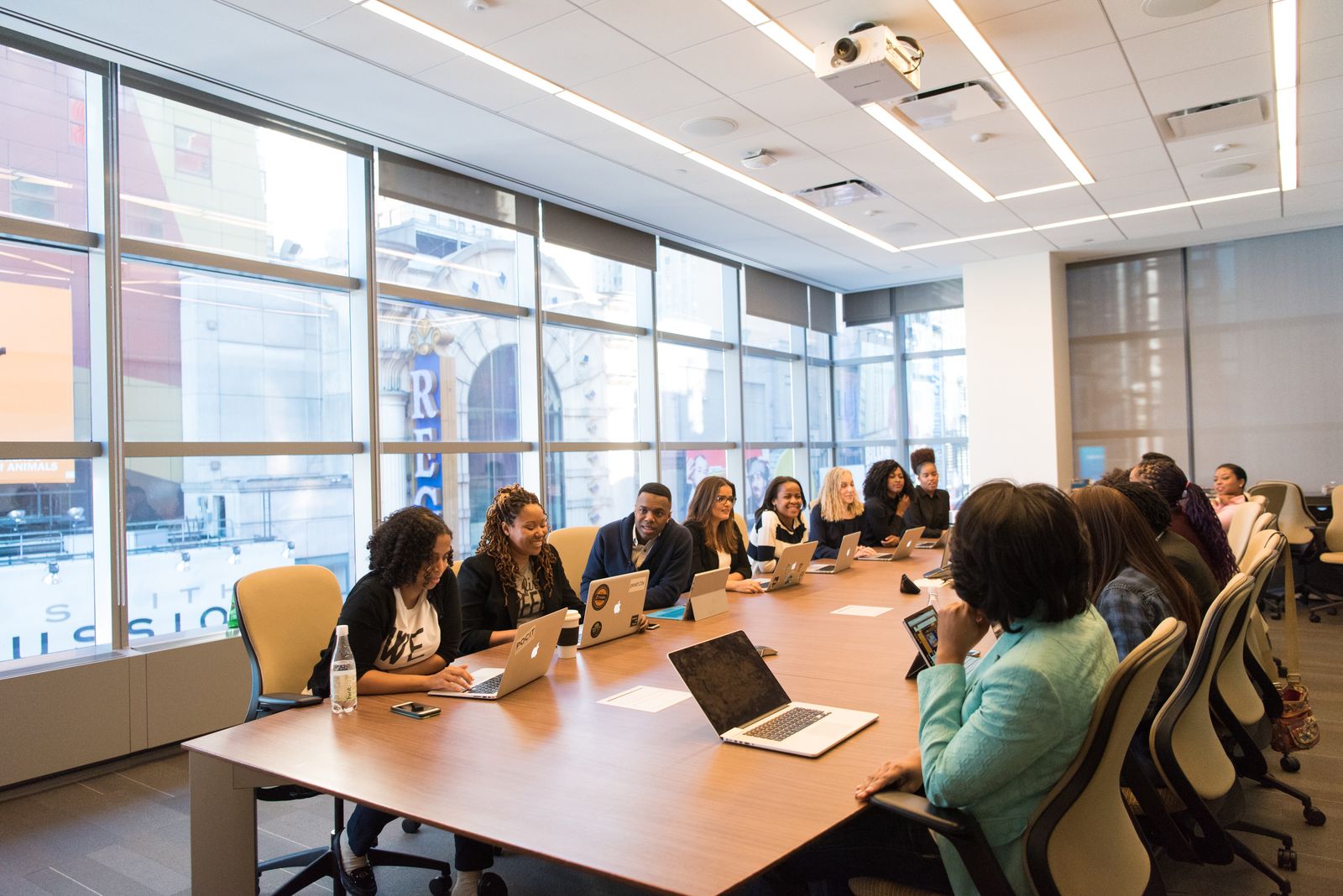 Presentation around a table in a premium meeting room with a view.