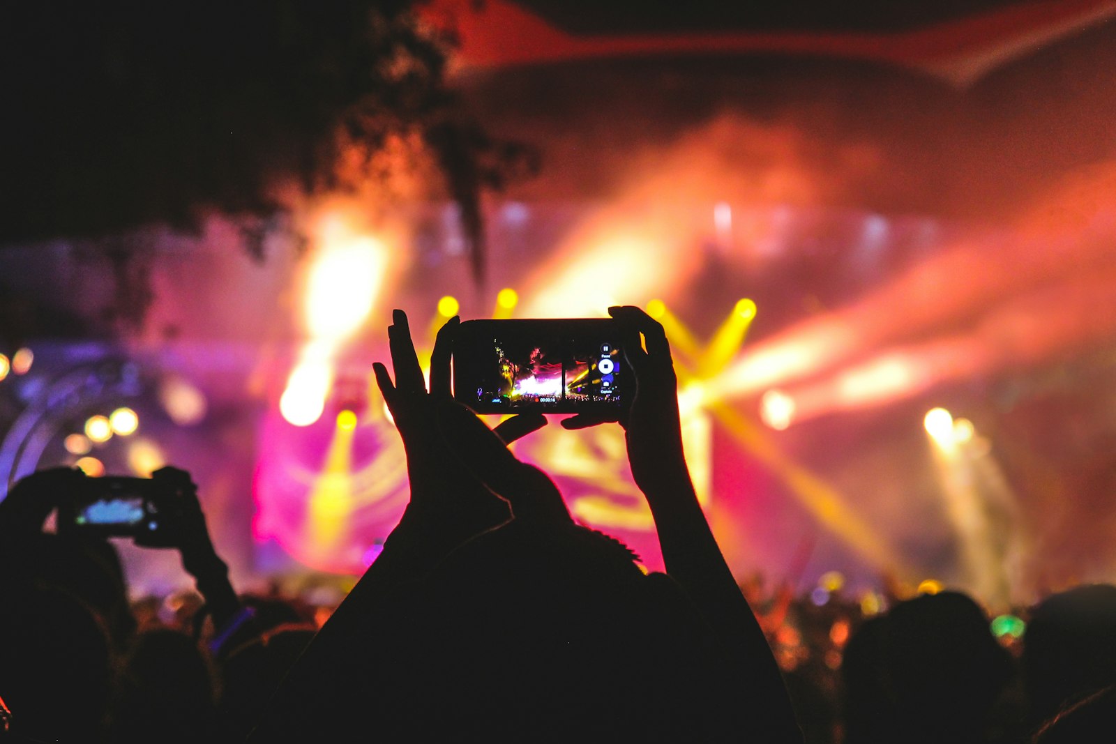 Concert stage with the crowd and strong stage lights.